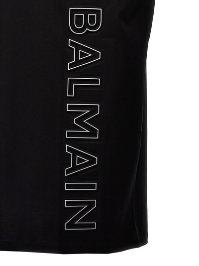 Balmain – T-Shirt mit vertikalem Prägelogo in Schwarz