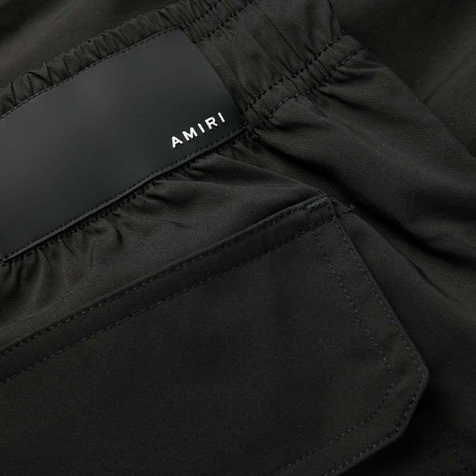 Amiri Logo Printed Swim Shorts in Black