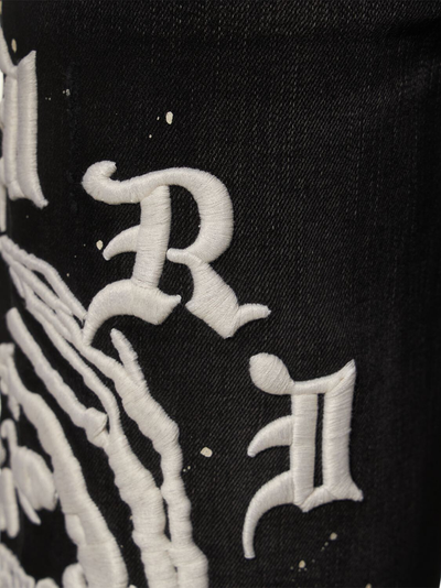 Amiri Wes Lang – Schwarze Jeans mit gealtertem Reaper-Logo