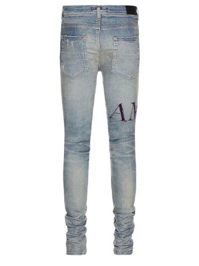 Amiri Serif Logo Clay Indigo Ripped Jeans in Blue